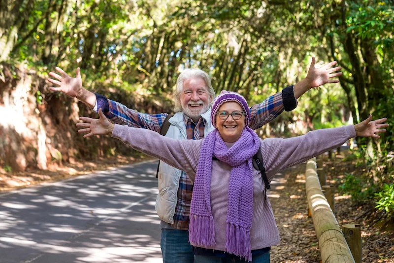 Happy elderly couple walking